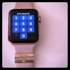 Rose gold Apple Watch series 3 w/ bytten charms.